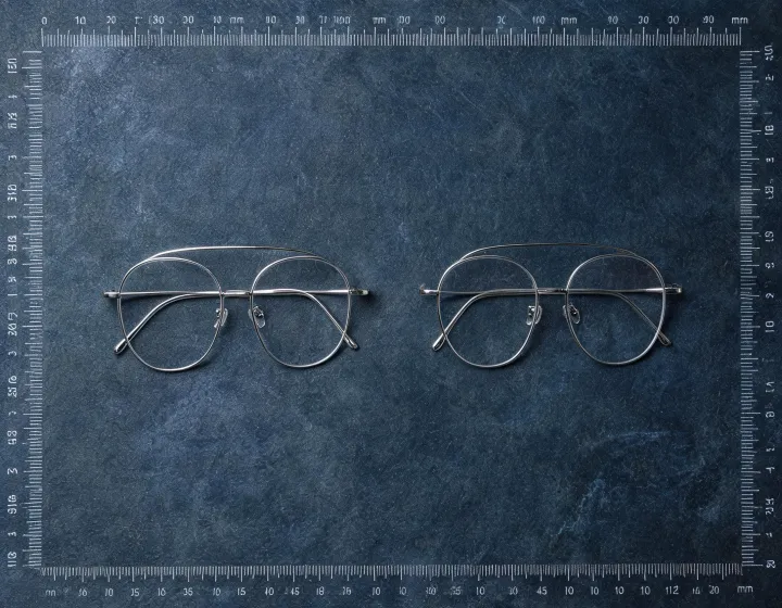 Custom metal frames laid out for millimetre size review